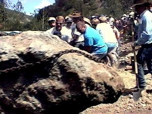 The Jarbridge Shovel Brigade removes a boulder blocking  a road into public land